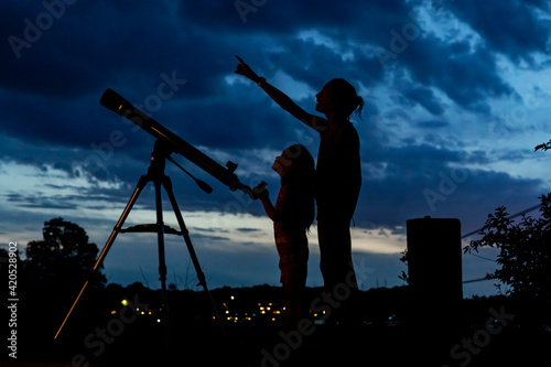 Two Young Girls with telescope for Science Learning photo