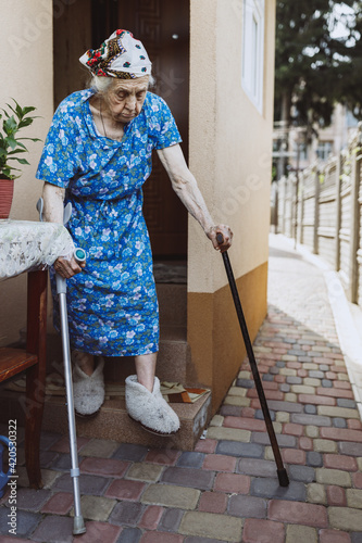 Grandmother strolling near home