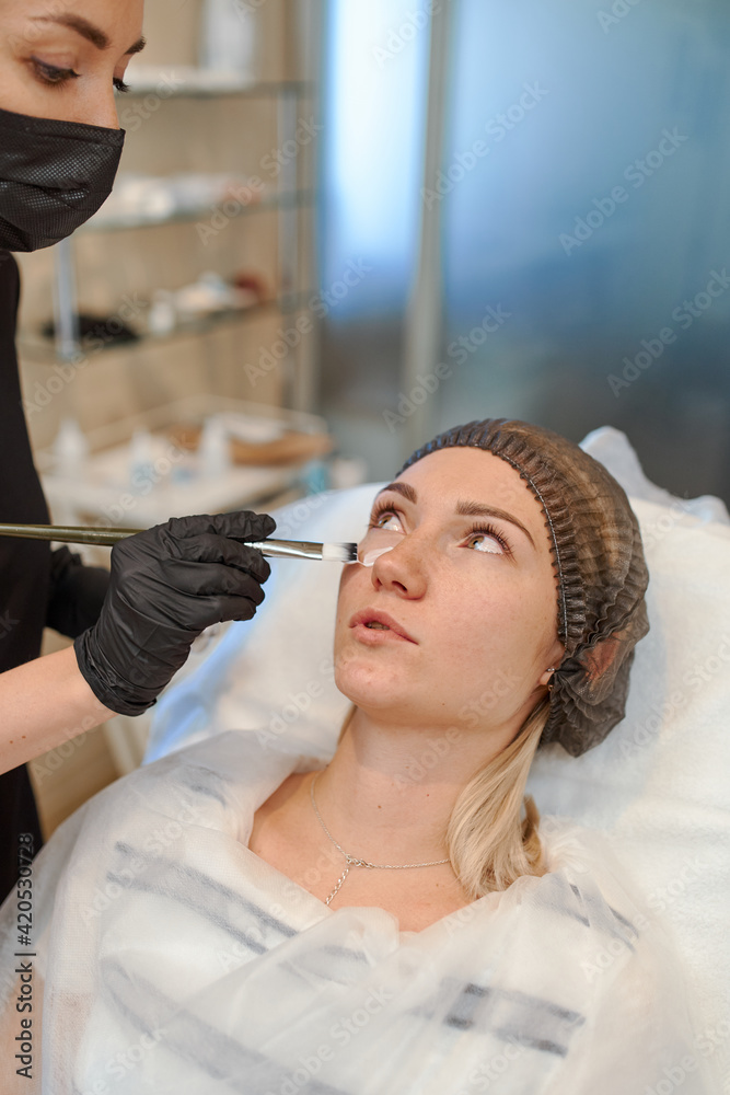 anti-aging care cosmetologist makes beauty injections in the face of a woman anti-aging care cosmetologist makes beauty injections in the face of a woman