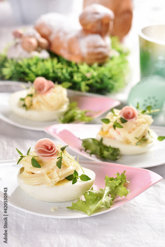 eggs with mayonnaise stuffed with vegetable salad on Easter table eggs with mayonnaise stuffed with vegetable salad on Easter table