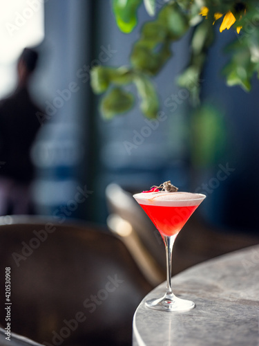 Red cocktail on a bar in a restaurant in Johannesburg