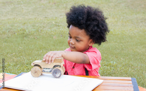 An african boy playing in backyard