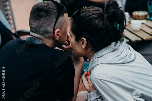 Woman Whispering To Her Friend