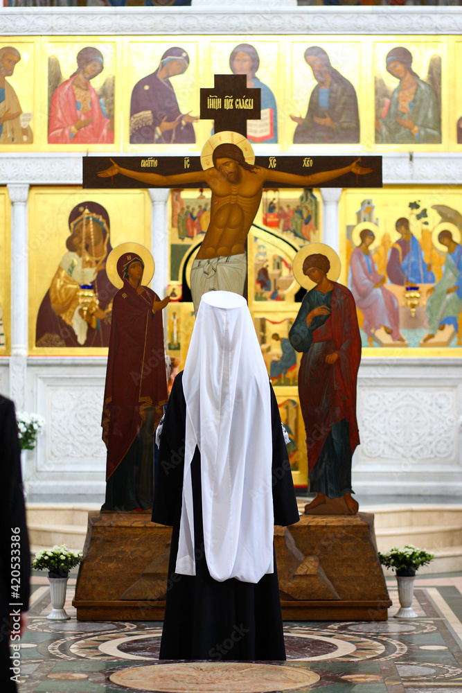 The Orthodox priest Metropolitan prays in the church before the Crucifixion of Jesus Christ (Golgotha), during Orthodox fasting. The concept of Orthodoxy.