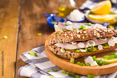 Canvas Print Dutch herring in a sandwich in grain bread