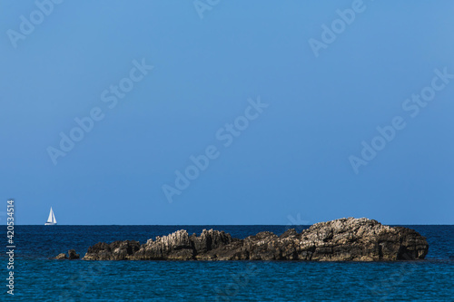 Sailboat on the sea horizon photo