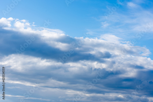 Cumulus clouds, dramatic summer sky of bad weather, thunderhead, beginning of heavy rain