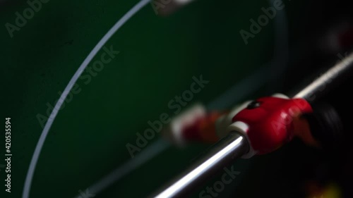 Toy footballer spins on his axis. Playing table football. High quality 4k footage