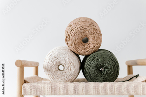 Natural yarn needles on chair photo