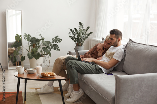 Modern Gay Couple Relaxing at Home