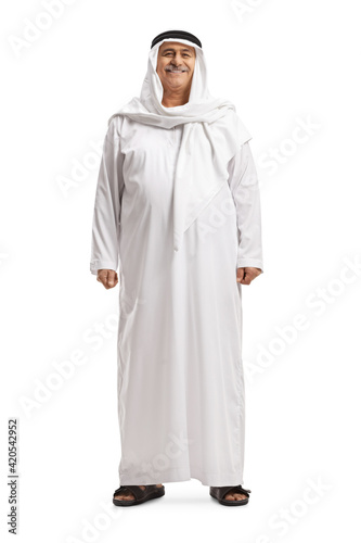 Full length portrait of a mature arab man in a traditional dishdasha