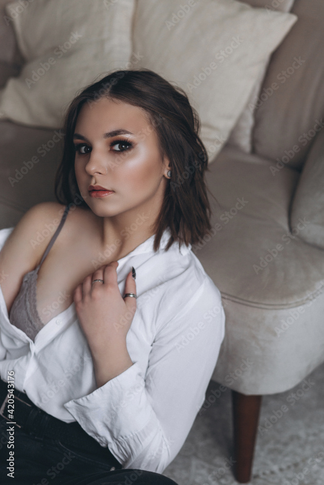 Portrait of young beauty brunette woman with stylish haircut indoors. Sexy, sensual, fashionable, caucasian girl