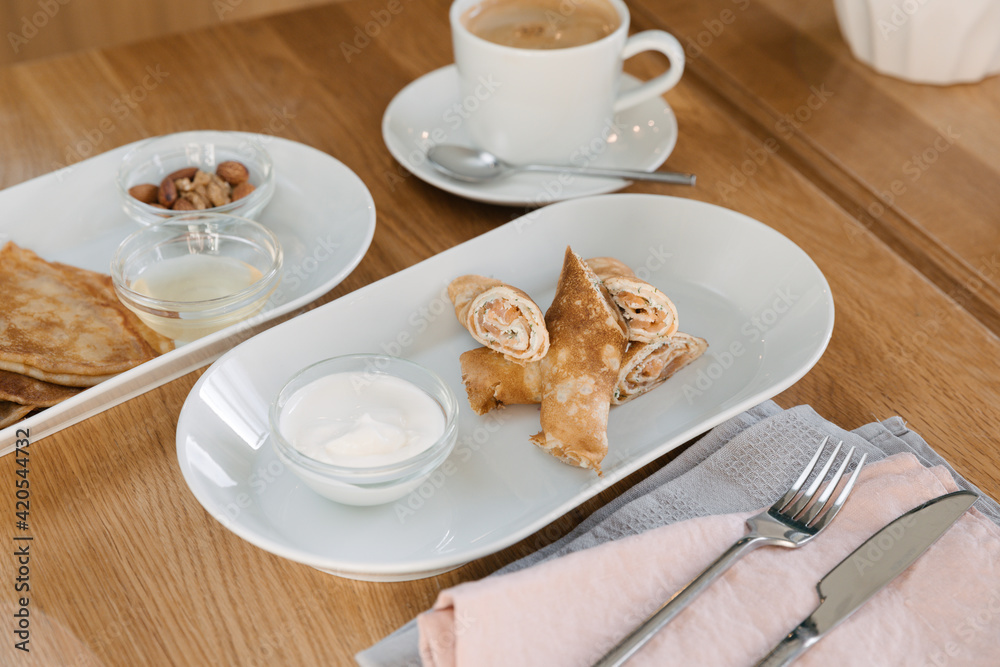 salmon pancakes with sour cream and coffee salmon pancakes with sour cream and coffee