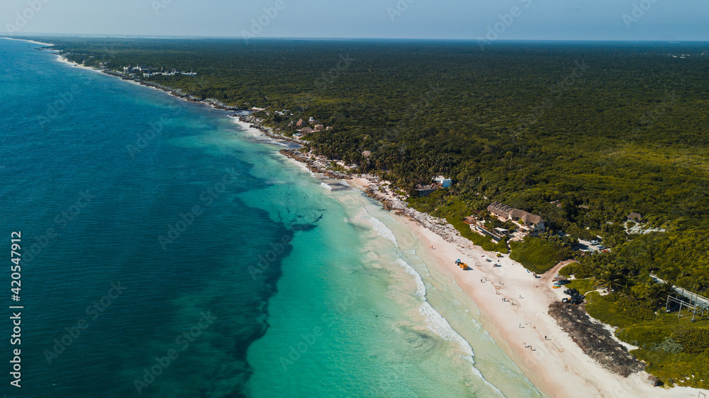 Mexico, drone shot of the beach with people on the deck chairs. Mexico, drone shot of the beach with people on the deck chairs.