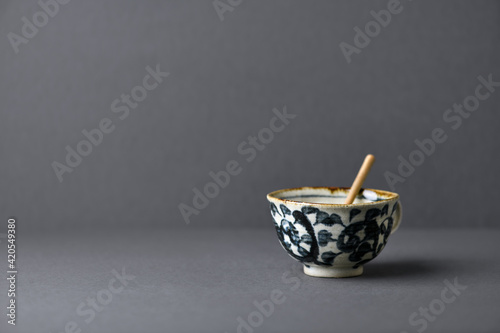 Traditional, handcrafted ceramic on gray background. Soft focus. Copy space.