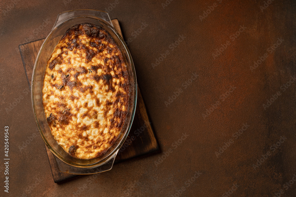 Freshly baked curd pudding in a baking dish Freshly baked curd pudding in a baking dish