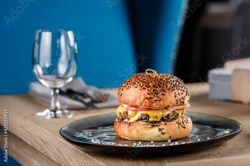 Cheeseburger on the wooden table