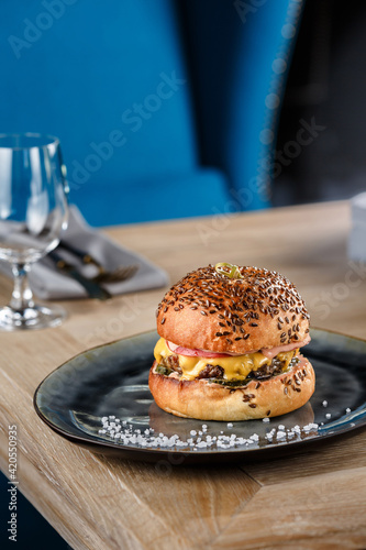 Cheeseburger on the wooden table