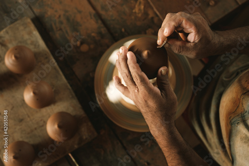 man working with clay photo