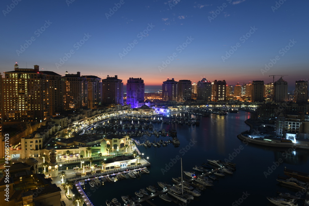 Fototapeta premium Beautiful Aerial View of Pearl Qatar. Roundabout Pearl Qatar at sunset time.
