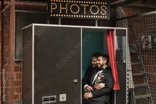 Gay couple in a photo booth photo