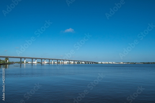 Roosevelt Bridge near downtown historic Stuart  Florida. Blue water  blue sky with a single cloud. Peaceful scene for this eastern Florida waterfront town.