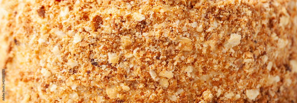 Honeycake with a lot of crunchy crumbs. cake textured background Honeycake with a lot of crunchy crumbs. cake textured background