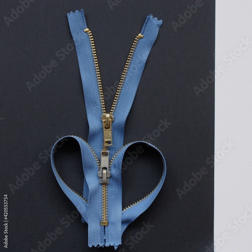 blue zippers on a black background