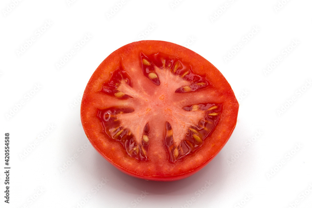 Half of tomato isolated on white Half of tomato isolated on white