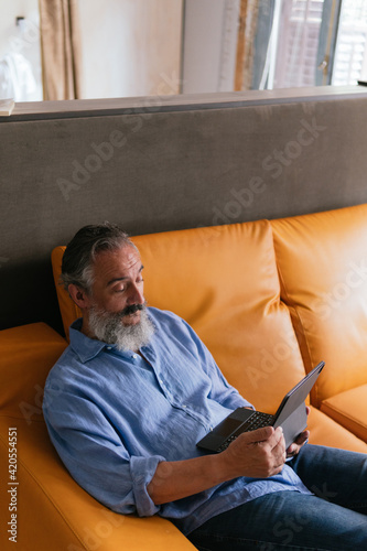 Old man using technology photo