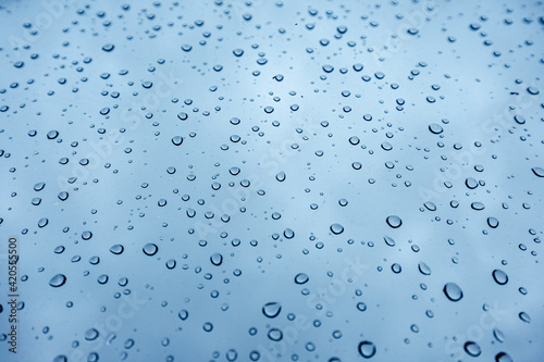 raindrops on the blue tinted glass. Popular scene photos for backgrounds