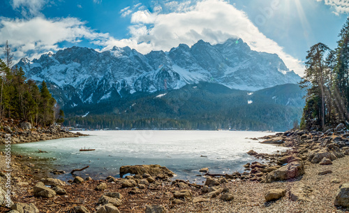 Winter view to the frozen lake and the Zugspitze at the background