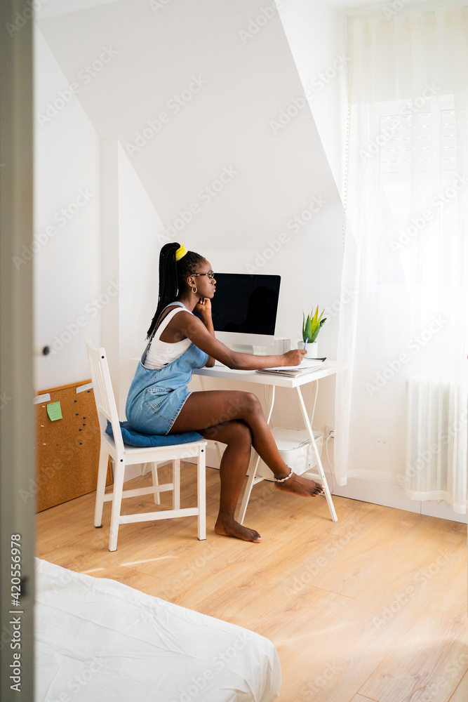 Girl Working At Home In Her Bedroom. Girl Working At Home In Her Bedroom.