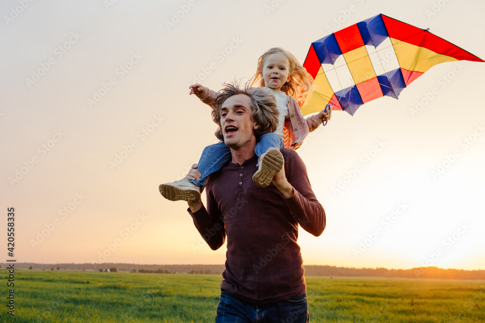 © Sergey Narevskih/Stocksy - Father and kid having fun with kite in field © Sergey Narevskih/Stocksy - Father and kid having fun with kite in field