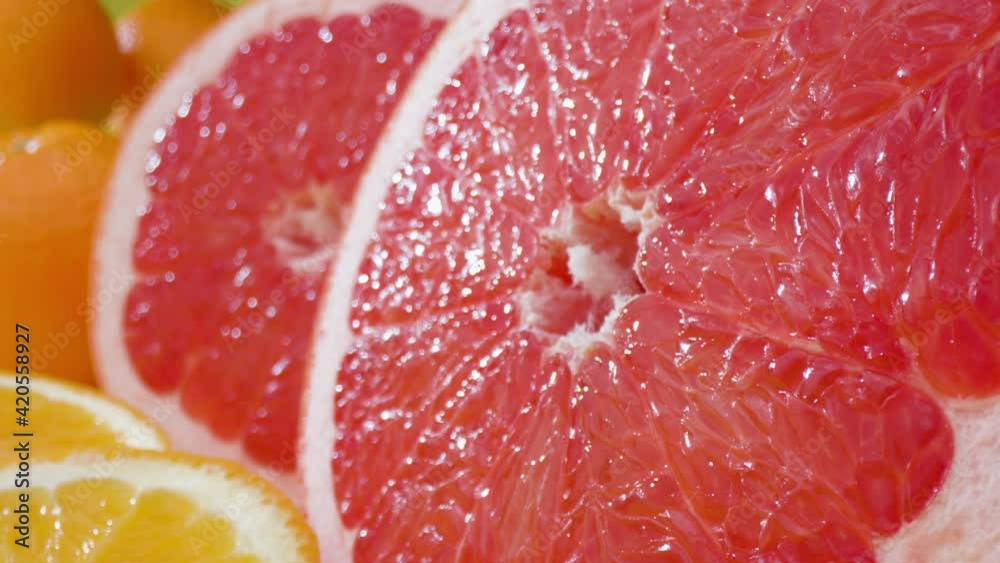 Multicoloured citrus fruits Macro shot of grapfruit with oranges around Multicoloured citrus fruits Macro shot of grapfruit with oranges around