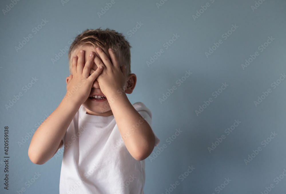 Frustrated and upset little boy with hand over face Frustrated and upset little boy with hand over face