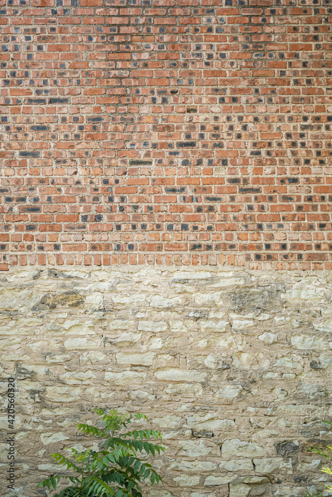 An old brick wall with multicolored bricks