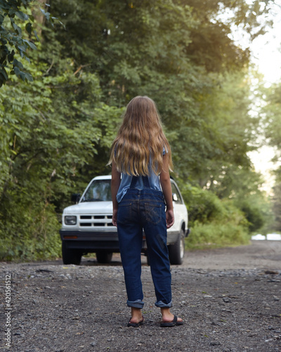 Child Looking at Dangerous Car Outside Walking Home