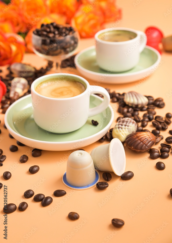 Capsules for an espresso machine in hand. Aromatic Italian coffee . Arabica coffee beans for the preparation of a traditional drink. Vertical . High quality photo Capsules for an espresso machine in hand. Aromatic Italian coffee . Arabica coffee beans for the preparation of a traditional drink. Vertical . High quality photo