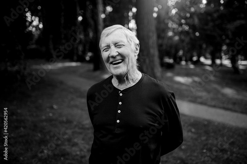 Happy, laughing senior man laughing outside.