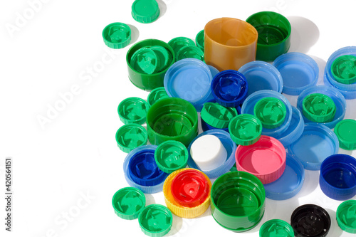 Pile of plastic caps for recycling. Copy space. View from above.