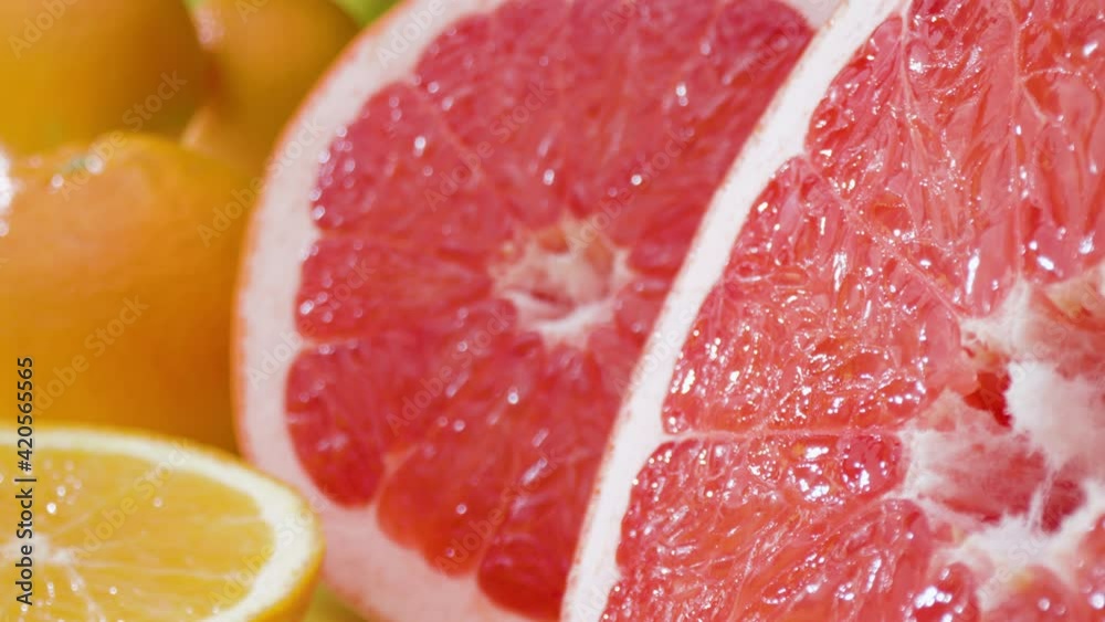 Multicoloured citrus fruits Macro shot of grapfruit with oranges around Multicoloured citrus fruits Macro shot of grapfruit with oranges around