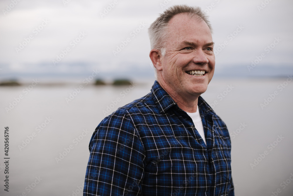 Boomer man enjoying life outside near the ocean. Boomer man enjoying life outside near the ocean.