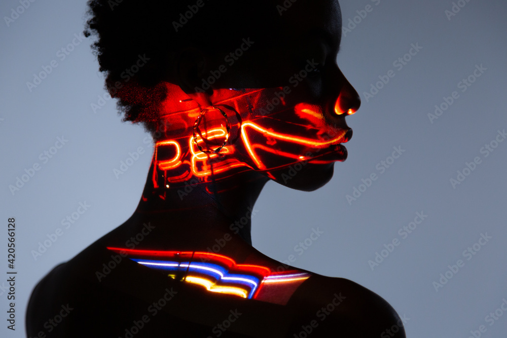 © MyMicrostock/Stocksy - Afro woman's back posing in the studio