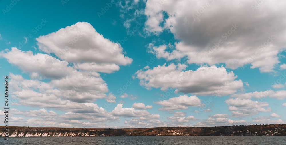Landscape photo of clouds in the sky near river