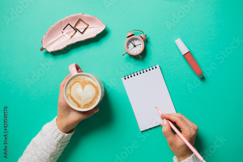 Woman making wish-list or plans and goals