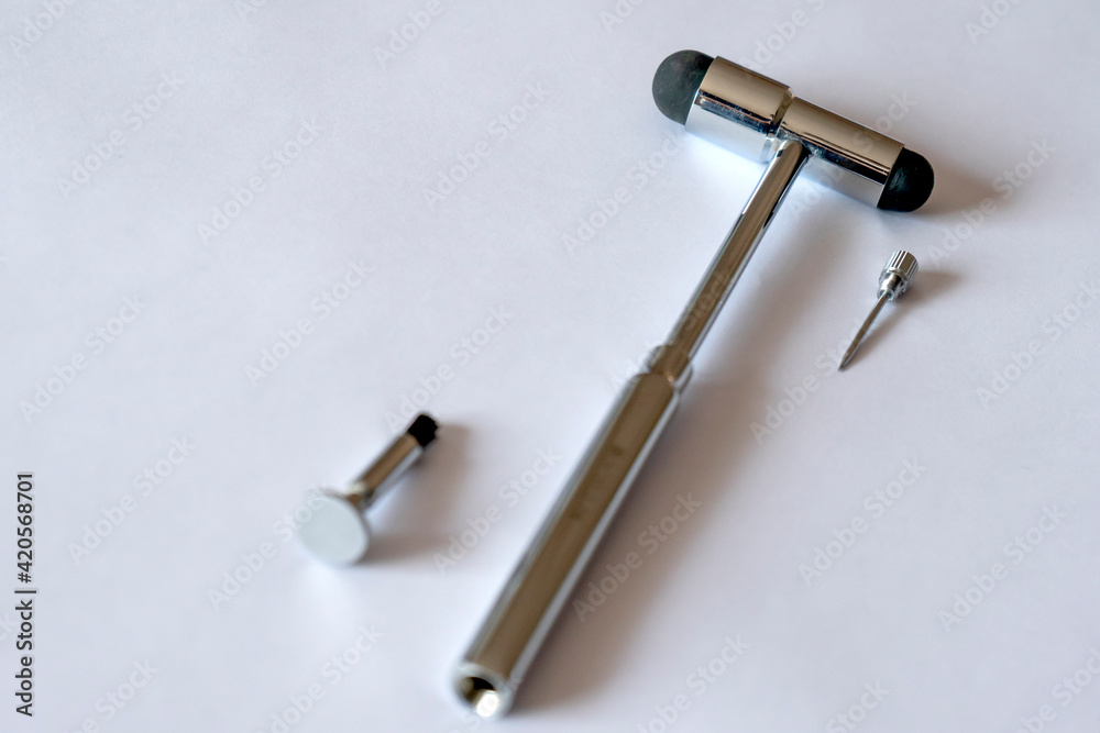 Fototapeta premium Isolated reflex hammer on white background. This medical instrument is used to check reflexion ability and for checking nerves.