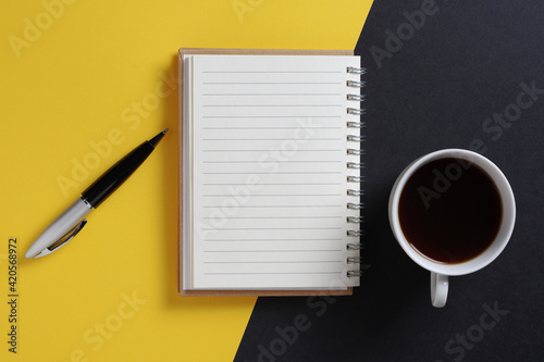 Notepad, pen and coffee cup