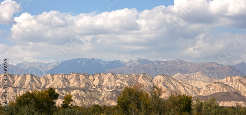 Beautiful mountains in Kyrgyzstan near Kazarman. Beautiful landscape with mountains at Kyrgyzstan on sunny day photo