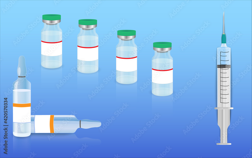 An injection syringe lying on the surface next to the coronavirus vaccine vials. An injection syringe lying on the surface next to the coronavirus vaccine vials.